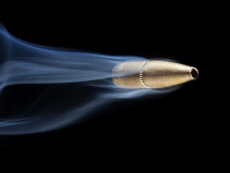 depositphotos_123111694-stock-photo-fast-bullet-with-smoke