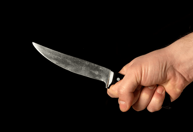 men-s-hand-holds-sharp-knife_192985-703