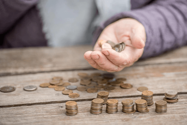 pensioner-counting-money-into-her-hands_161307-206