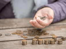 pensioner-counting-money-into-her-hands_161307-206